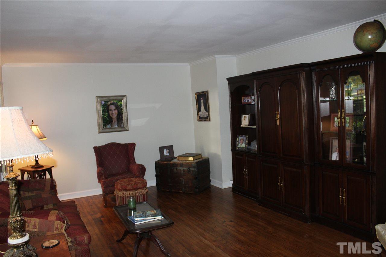 4204 Redington Drive Raleigh, NC 27609 - Photo 4 of 10 a living room with furniture and wooden floor
