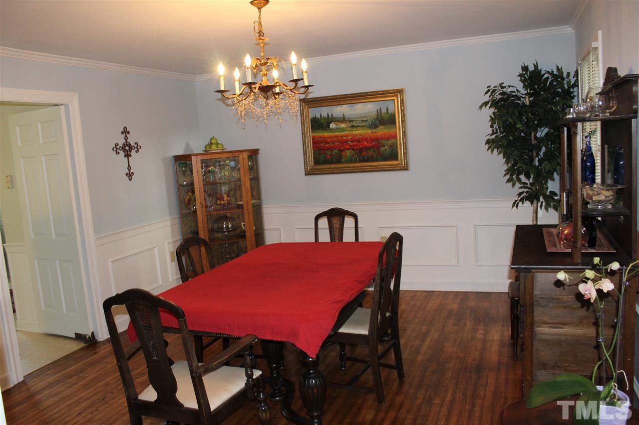 4204 Redington Drive Raleigh, NC 27609 - Photo 5 of 10 a view of a dining room with furniture and wooden floor
