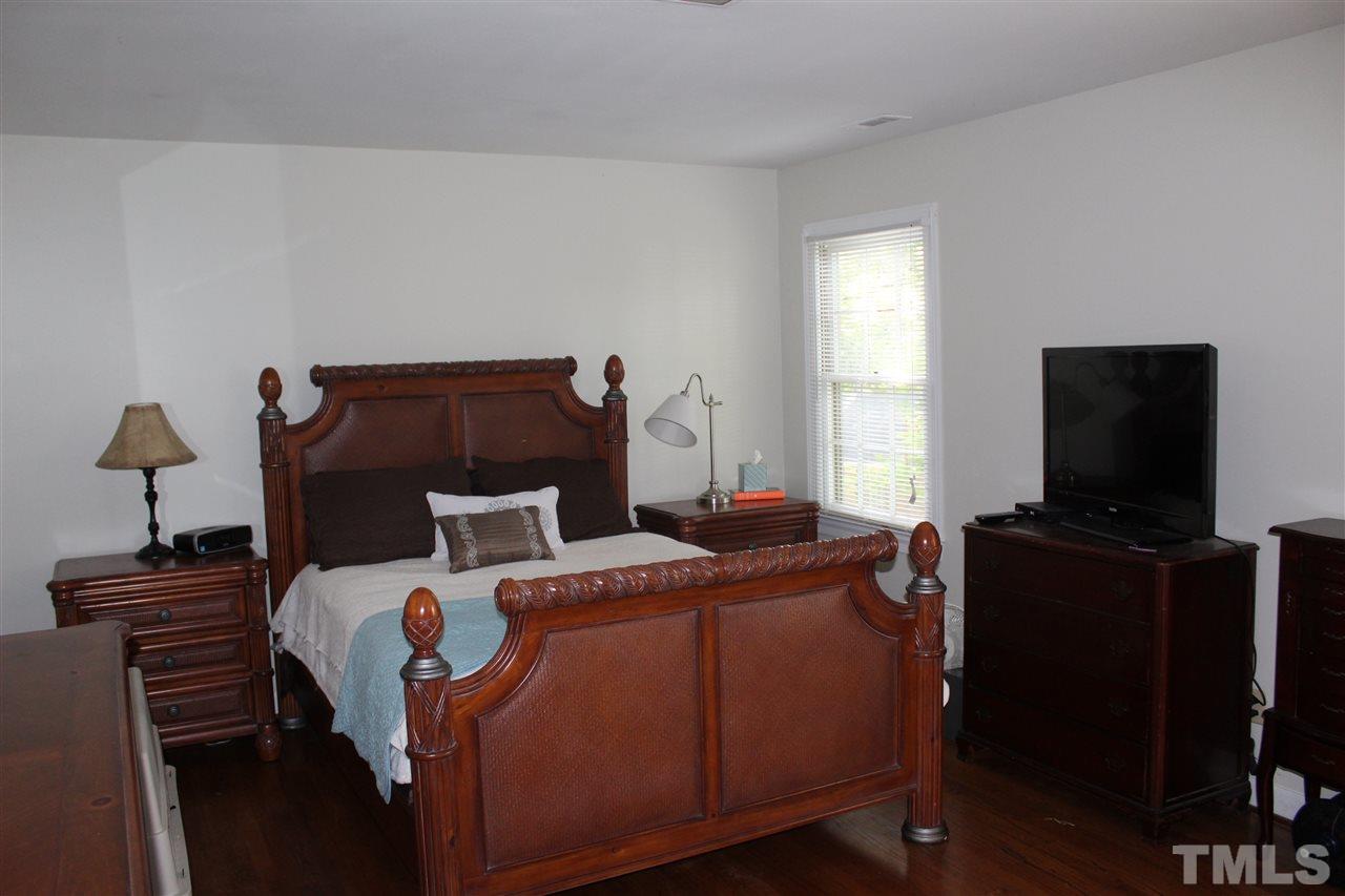4204 Redington Drive Raleigh, NC 27609 - Photo 9 of 10 a room with a bed and a television