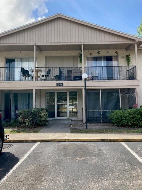 a front view of a building and that has a garage