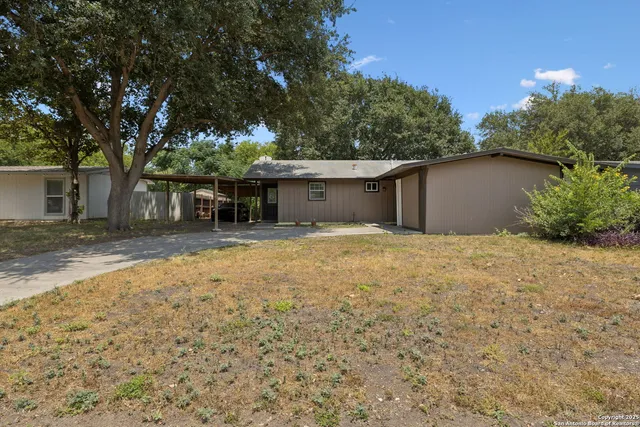 a house with trees in front of it