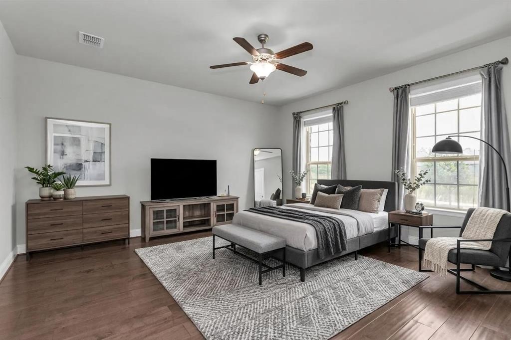 6333 Hall Road Frisco, TX 75034 - Photo 19 of 38 Spacious room with wood-finish flooring, light grey wall paint, and a ceiling fan
