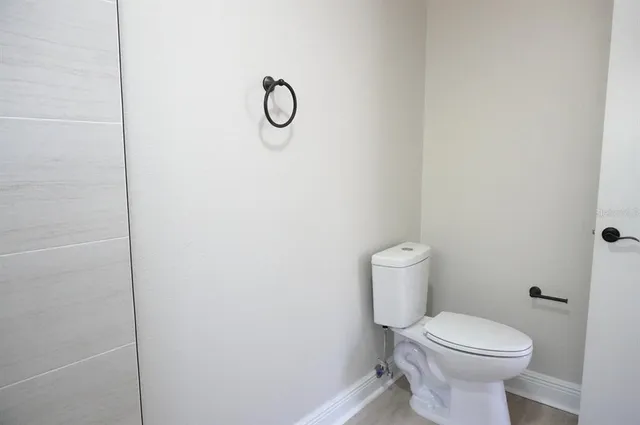 a view of a bathroom from a door