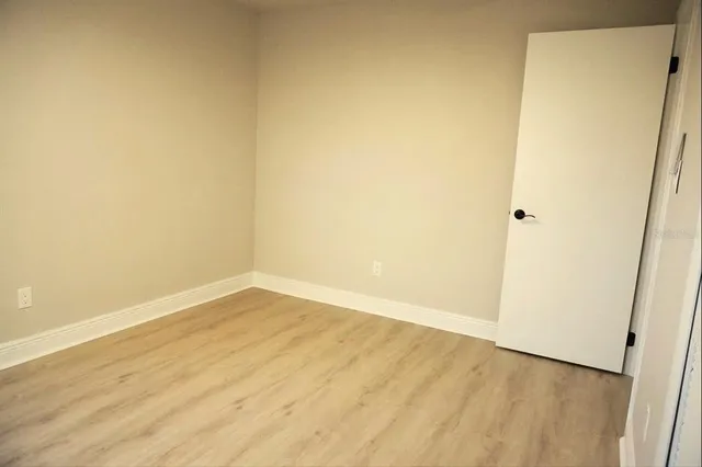 a bathroom with a granite countertop sink a toilet and bathtub