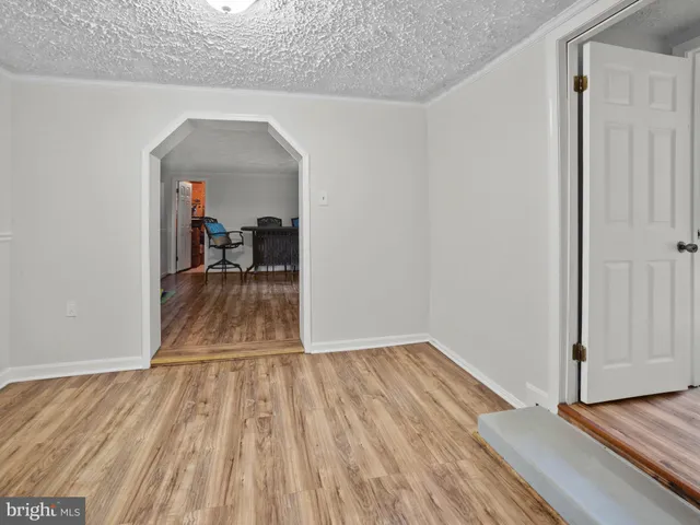 a view of a room & wooden floor