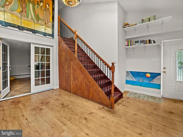 a view of an entryway with wooden floor