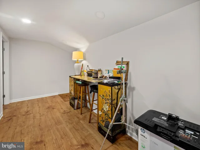 a view of workspace with wooden floor