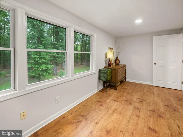 a room with a window and workspace