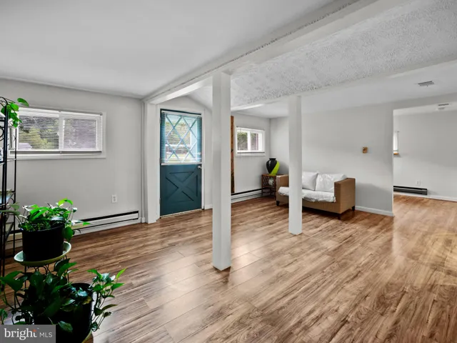 a living room with furniture and flowers