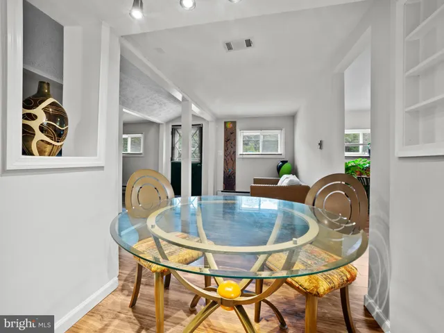 a view of a dining room with furniture and chandelier