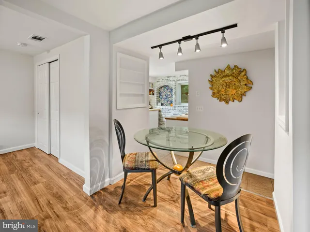 a dining room with furniture and window