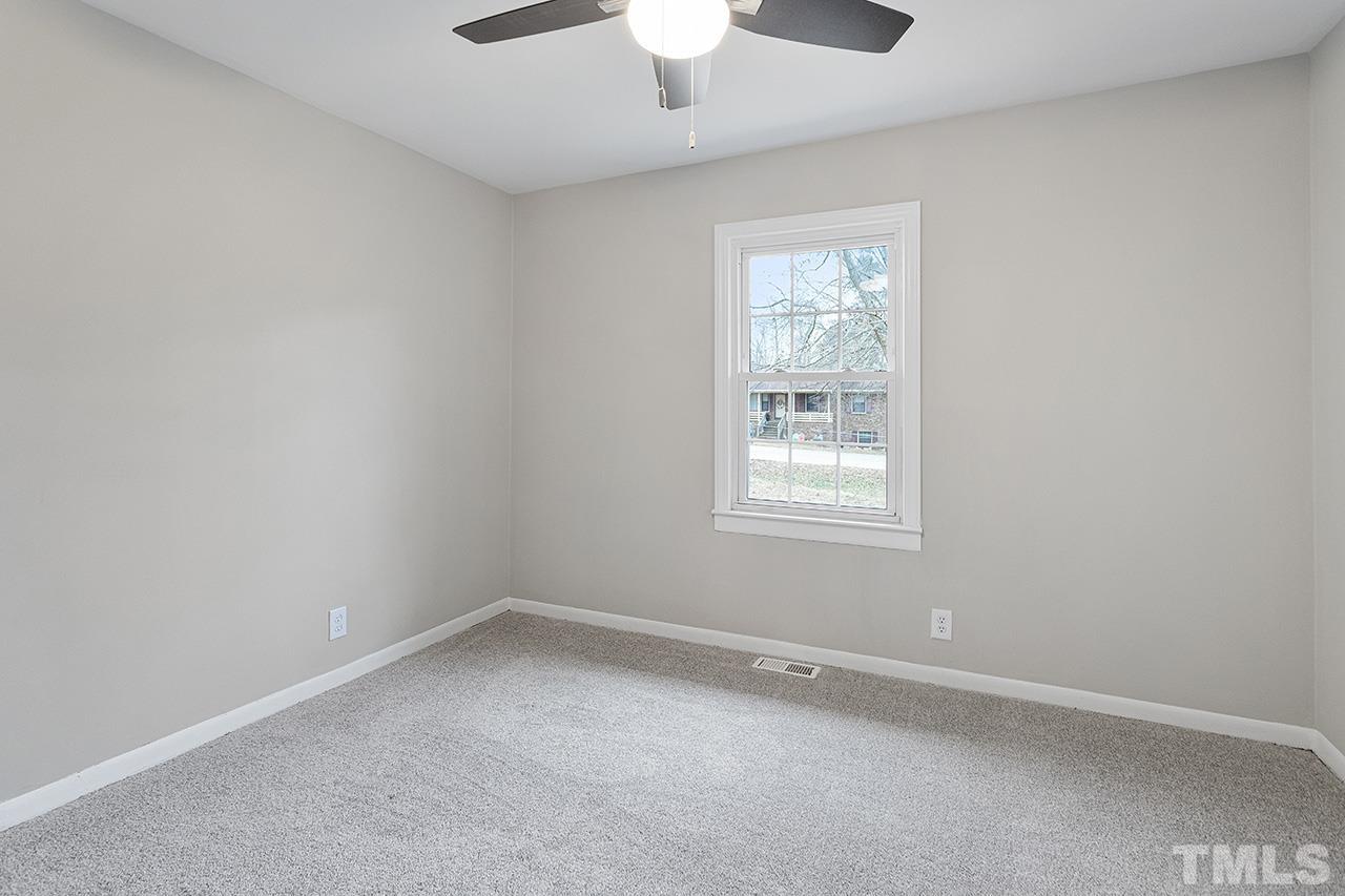 3915 Butler Boulevard Raleigh, NC 27604 - Photo 16 of 30 an empty room with a window