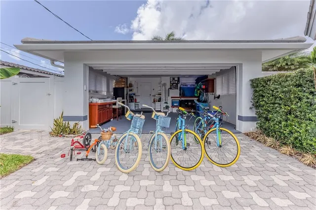 a view of a patio with table and chairs with wooden fence