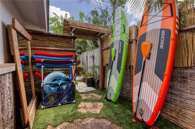 a view of swimming pool with a table and chairs