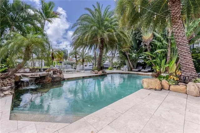 a view of swimming pool with chairs