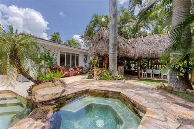 a view of a lake with boats and trees in the background