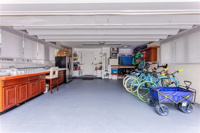 a picture of a table and a vase with flowers