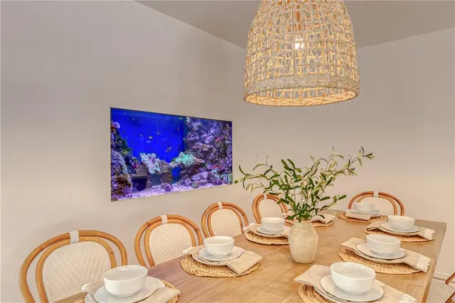 a large kitchen with kitchen island a large island in it