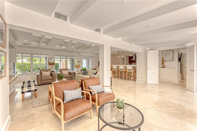 a bedroom with a large bed and a large window