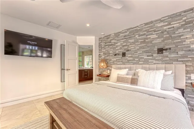 a living room with hardwood floor and a large window