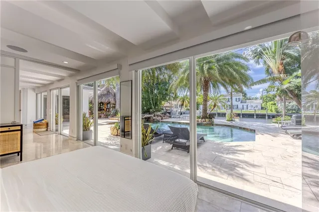 a bathroom with a granite countertop sink and a large mirror