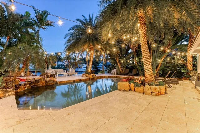 a view of a swimming pool with chairs