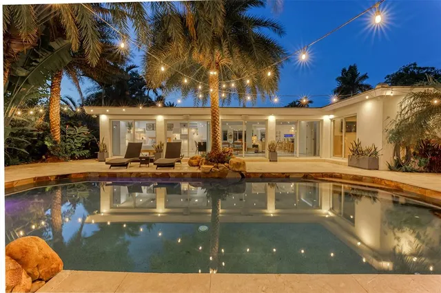 a view of a chairs and table in the patio