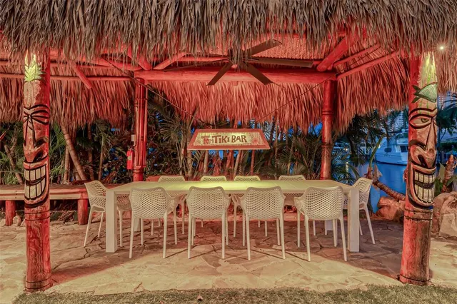 a view of a house with swimming pool and a garden