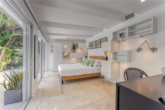 a bedroom with a bed and a cabinets