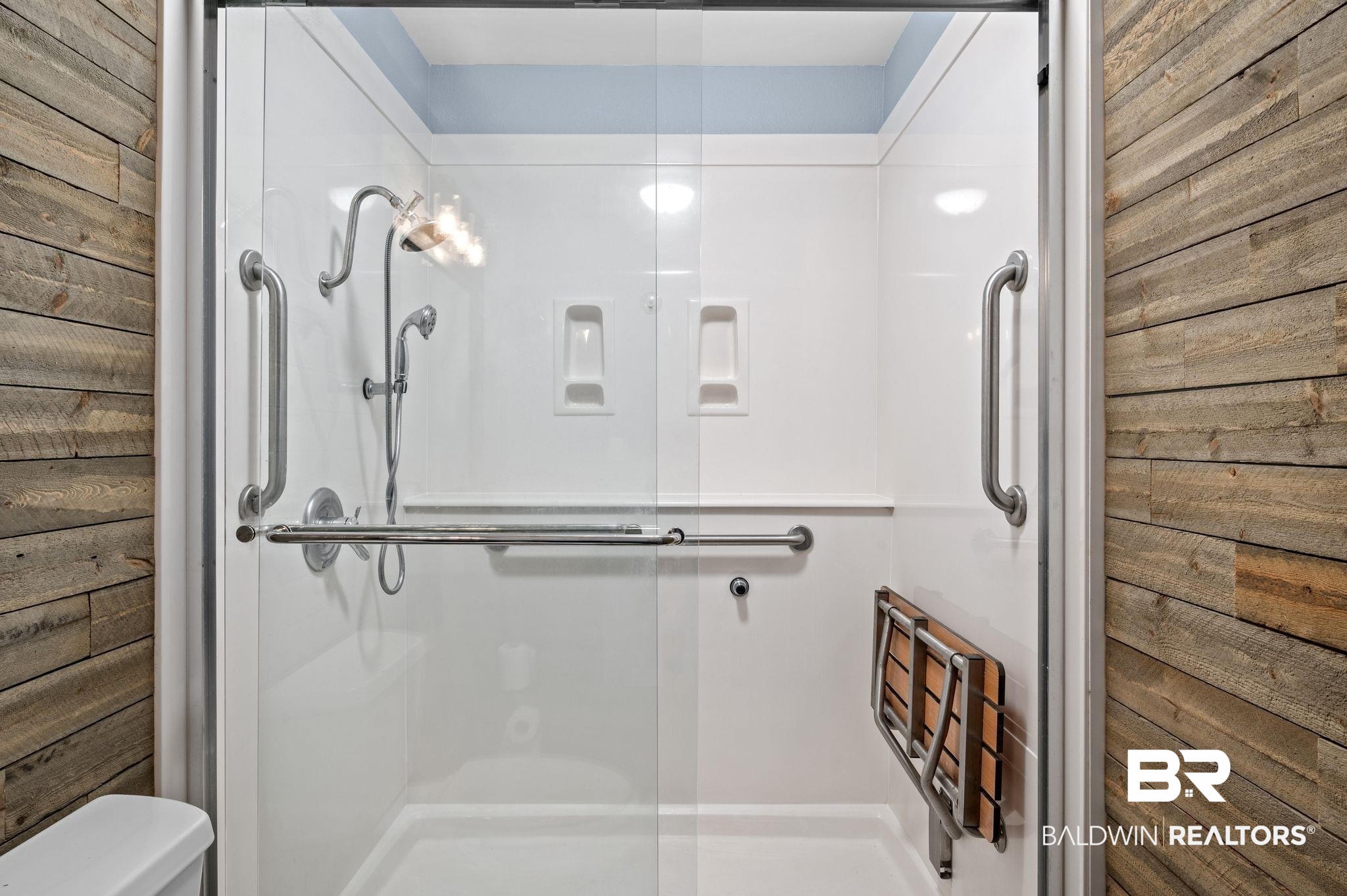 3716 Pepper Ridge Drive Mobile, AL 36693 - Photo 13 of 20 Bathroom featuring toilet, a shower with door, and wooden walls
