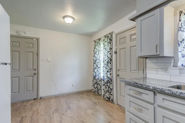 a room with cabinets and a window