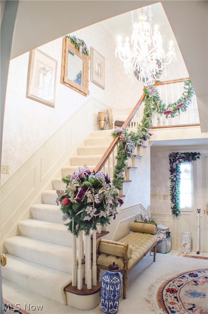 3383 Stanley Road Akron, OH 44333 - Photo 2 of 23 Elegant turned staircase greets your guess and bathes the foyer with natural lighting.