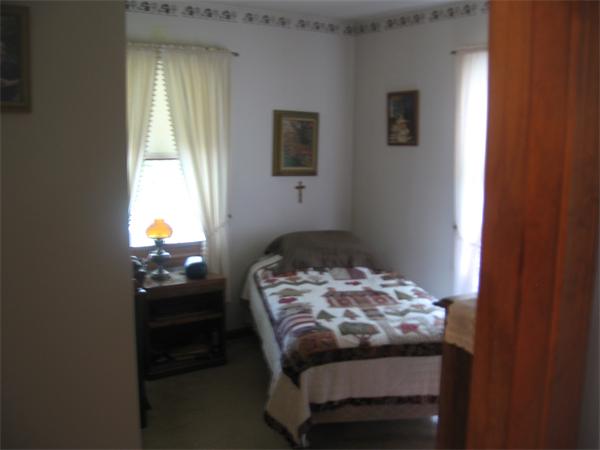 44 Old Main Road Worthington, MA 01098 - Photo 13 of 15 a bedroom with a bed and a window