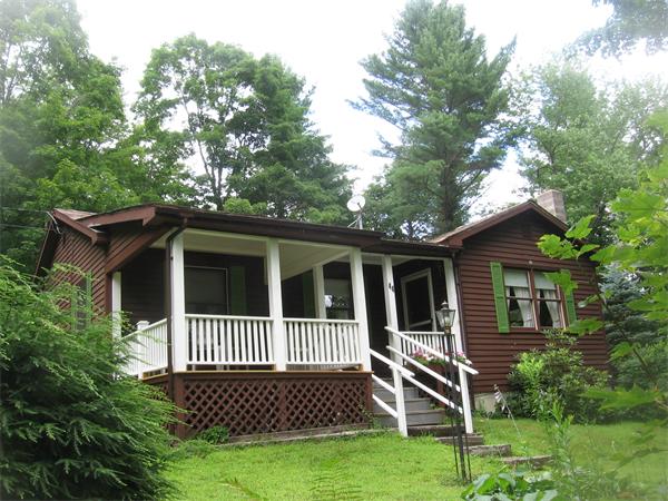 44 Old Main Road Worthington, MA 01098 - Photo 3 of 15 a porch with a yard