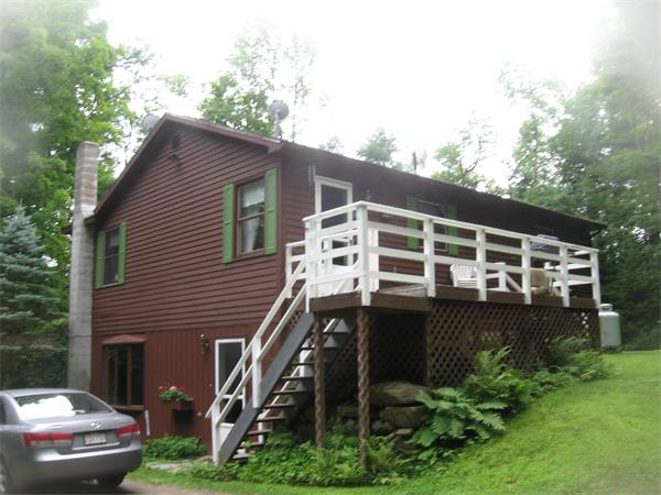 44 Old Main Road Worthington, MA 01098 - Photo 4 of 15 a front view of a house with a garden