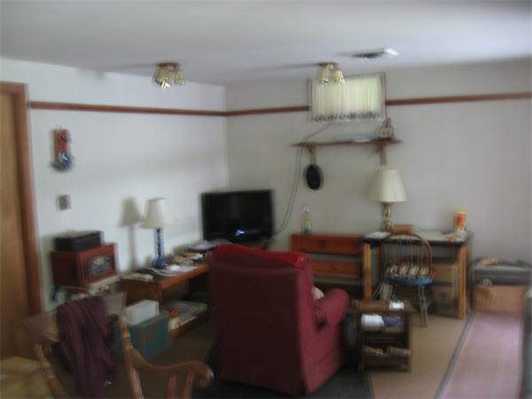 44 Old Main Road Worthington, MA 01098 - Photo 10 of 15 a living room with furniture and a flat screen tv