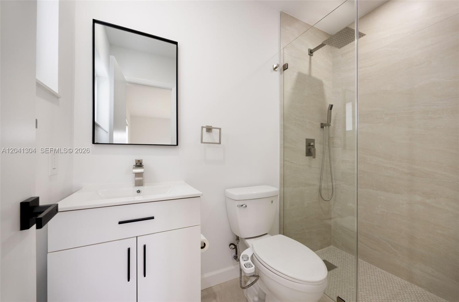 10340 Southwest 157th Street Miami, FL 33157 - Photo 12 of 24 Bathroom – Modern full bathroom with stylish vanity, upgraded fixtures, and a spacious glass-enclosed shower. Thoughtfully finished for both comfort and functionality.