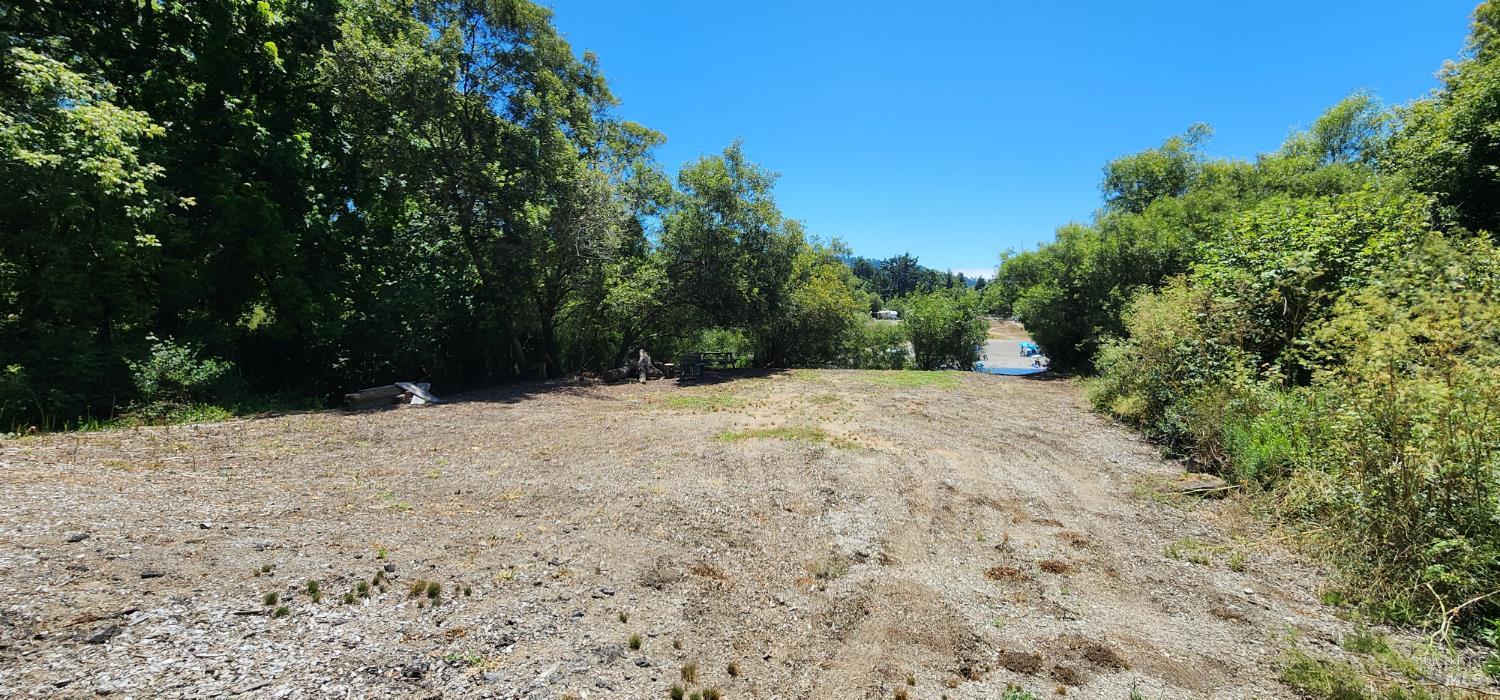 23001 Conifer Drive Monte Rio, CA 95462 - Photo 19 of 20 Huge level lower area with river access and a shady area with a picnic table.