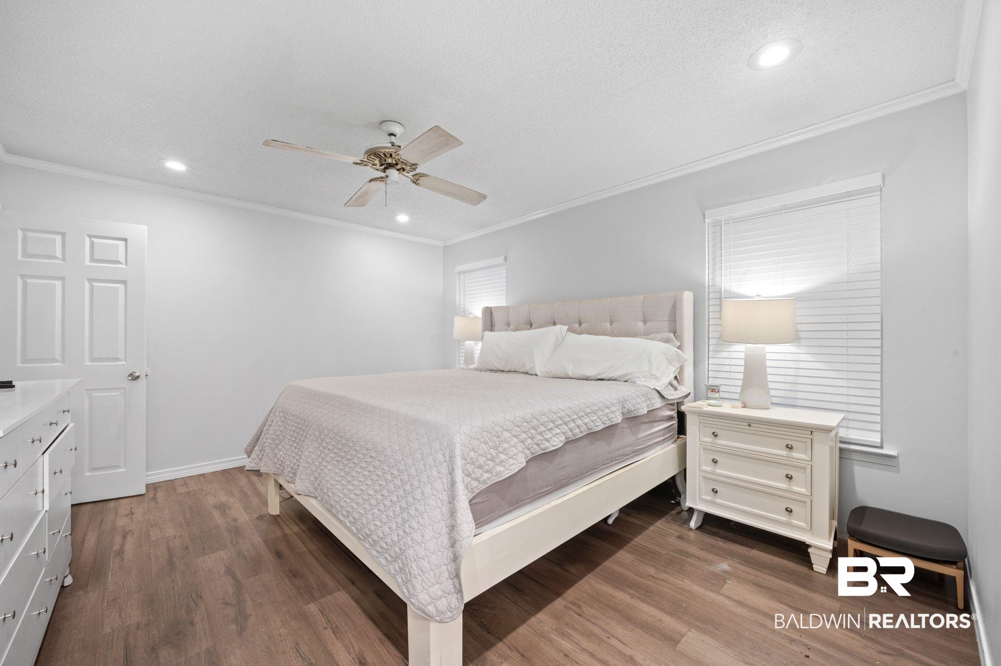 6705 Autumn Ridge Drive Mobile, AL 36695 - Photo 19 of 24 Bedroom featuring multiple windows, ceiling fan, and dark hardwood / wood-style floors