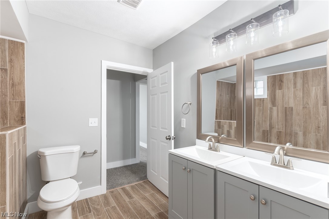 3517 Bainbridge Road Cleveland Heights, OH 44118 - Photo 20 of 35 Bathroom featuring toilet and double vanity