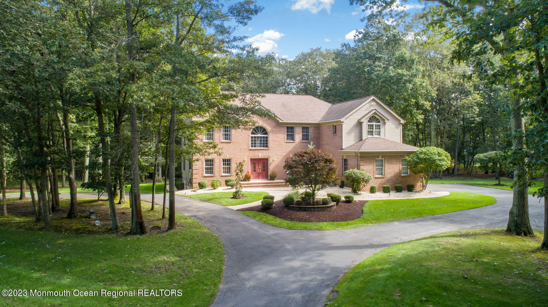 a front view of a house with a yard table and chairs