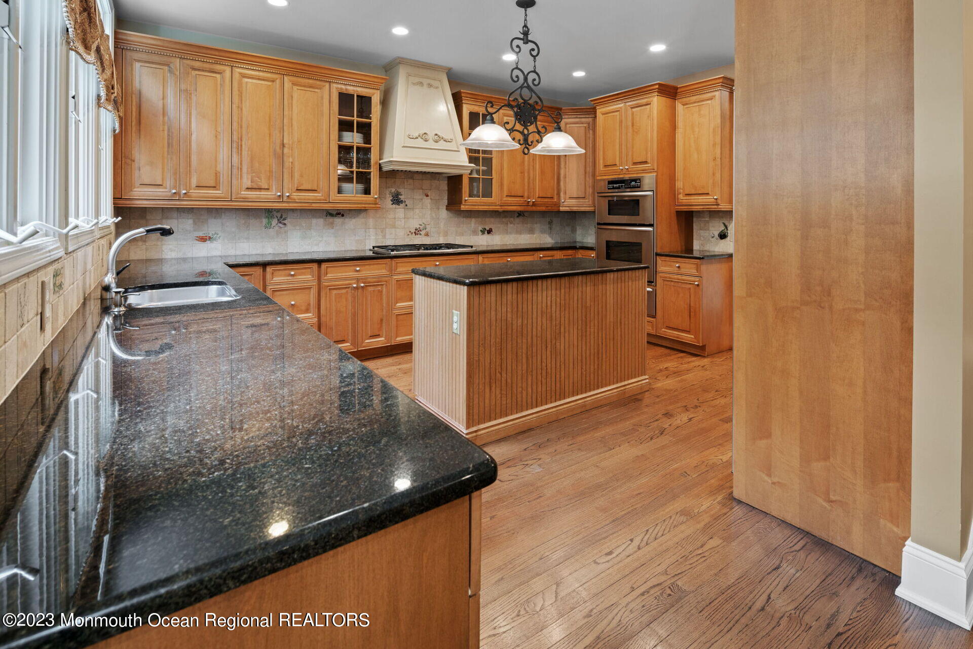 81 Agress Road Millstone Township, NJ 08535 - Photo 11 of 35 a kitchen with stainless steel appliances granite countertop a sink a stove and a refrigerator