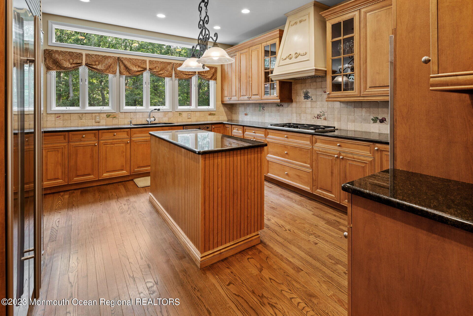 81 Agress Road Millstone Township, NJ 08535 - Photo 12 of 35 a kitchen with stainless steel appliances granite countertop a sink and wooden cabinets