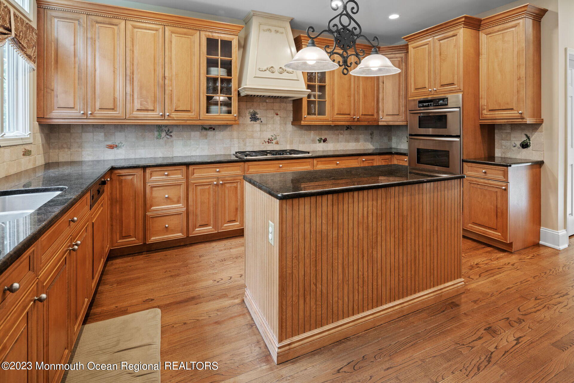 81 Agress Road Millstone Township, NJ 08535 - Photo 14 of 35 a kitchen with stainless steel appliances granite countertop a stove a sink and a microwave