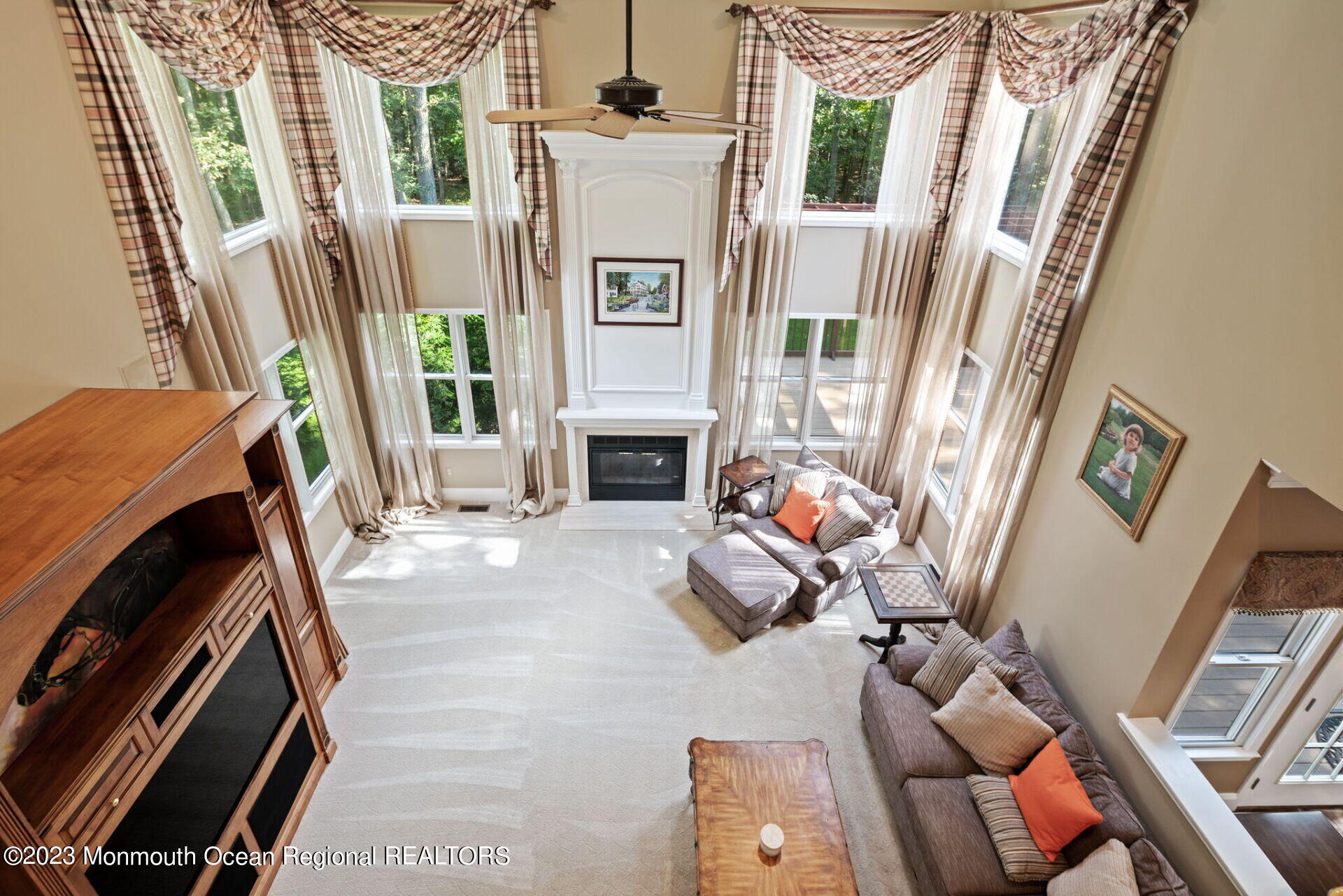81 Agress Road Millstone Township, NJ 08535 - Photo 19 of 35 a living room with furniture and a fireplace