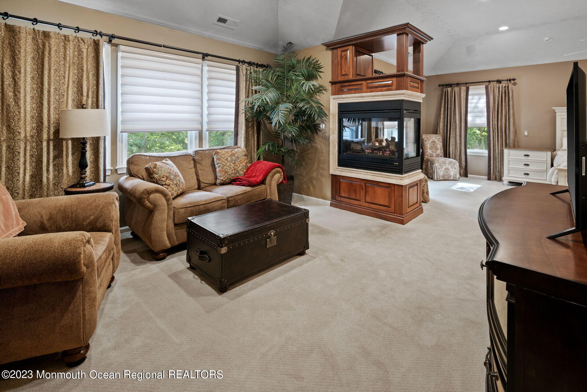 81 Agress Road Millstone Township, NJ 08535 - Photo 20 of 35 a living room with furniture and a fireplace