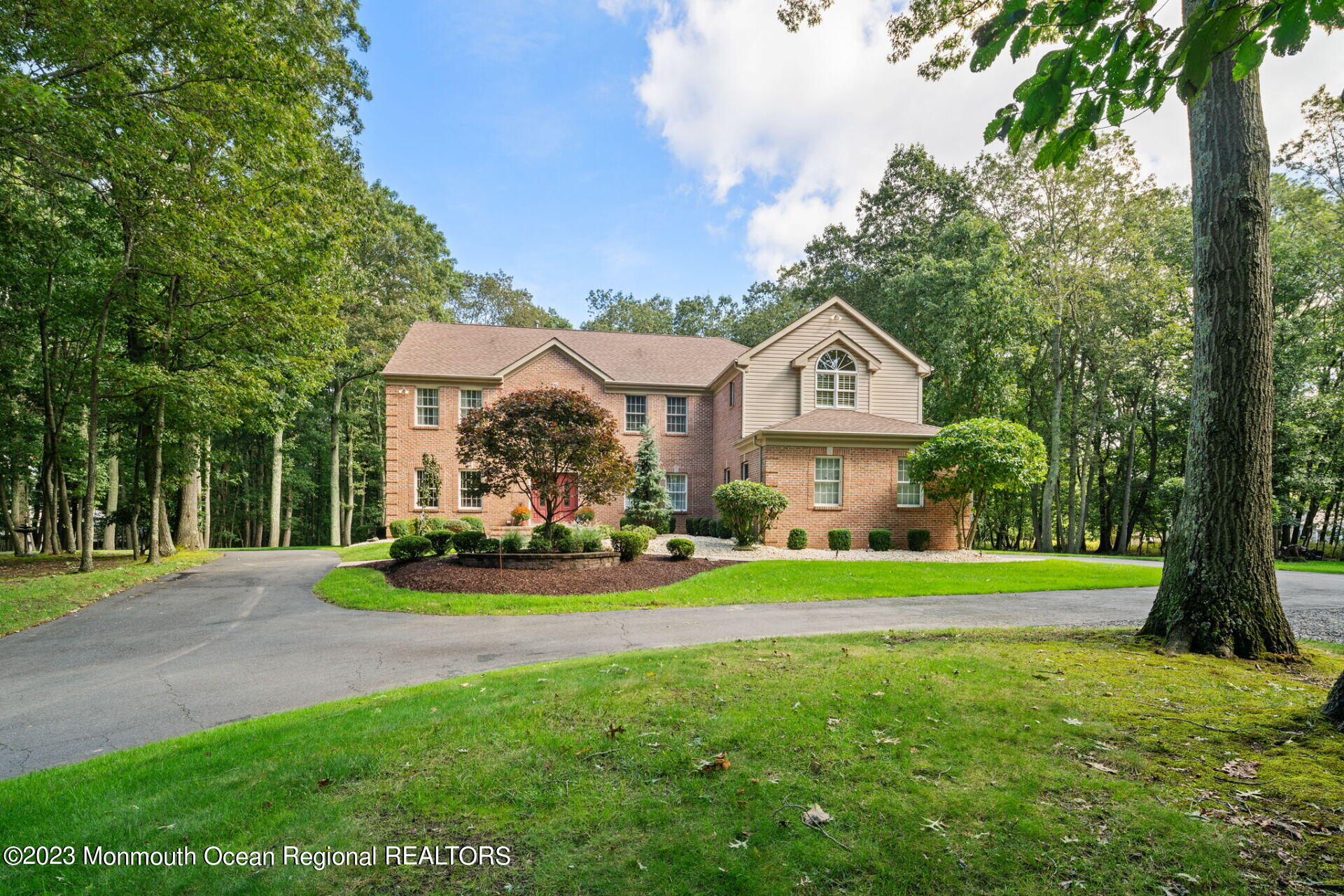 81 Agress Road Millstone Township, NJ 08535 - Photo 2 of 35 a front view of a house with garden and trees