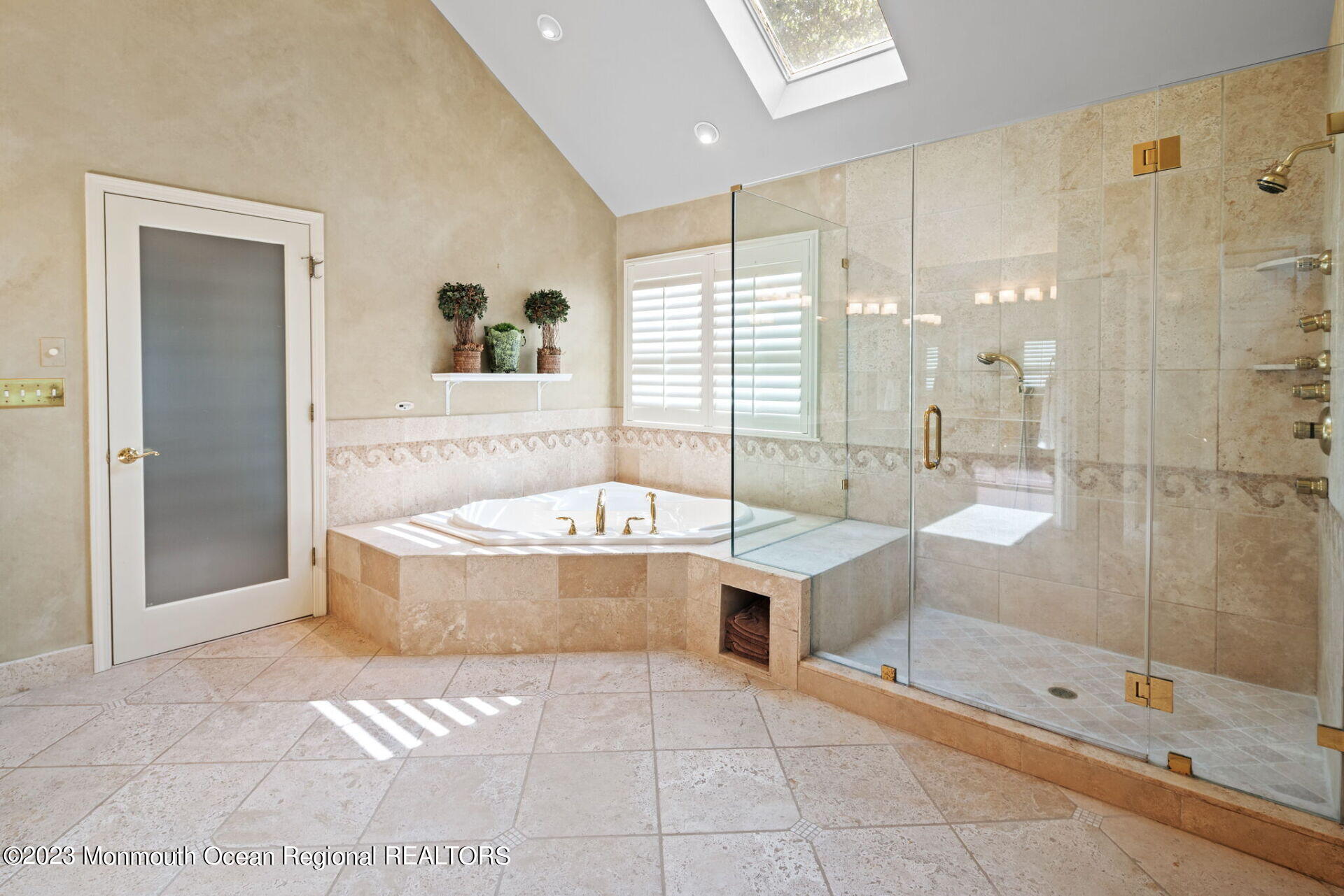 81 Agress Road Millstone Township, NJ 08535 - Photo 25 of 35 a bathroom with a tub a sink and glass door shower