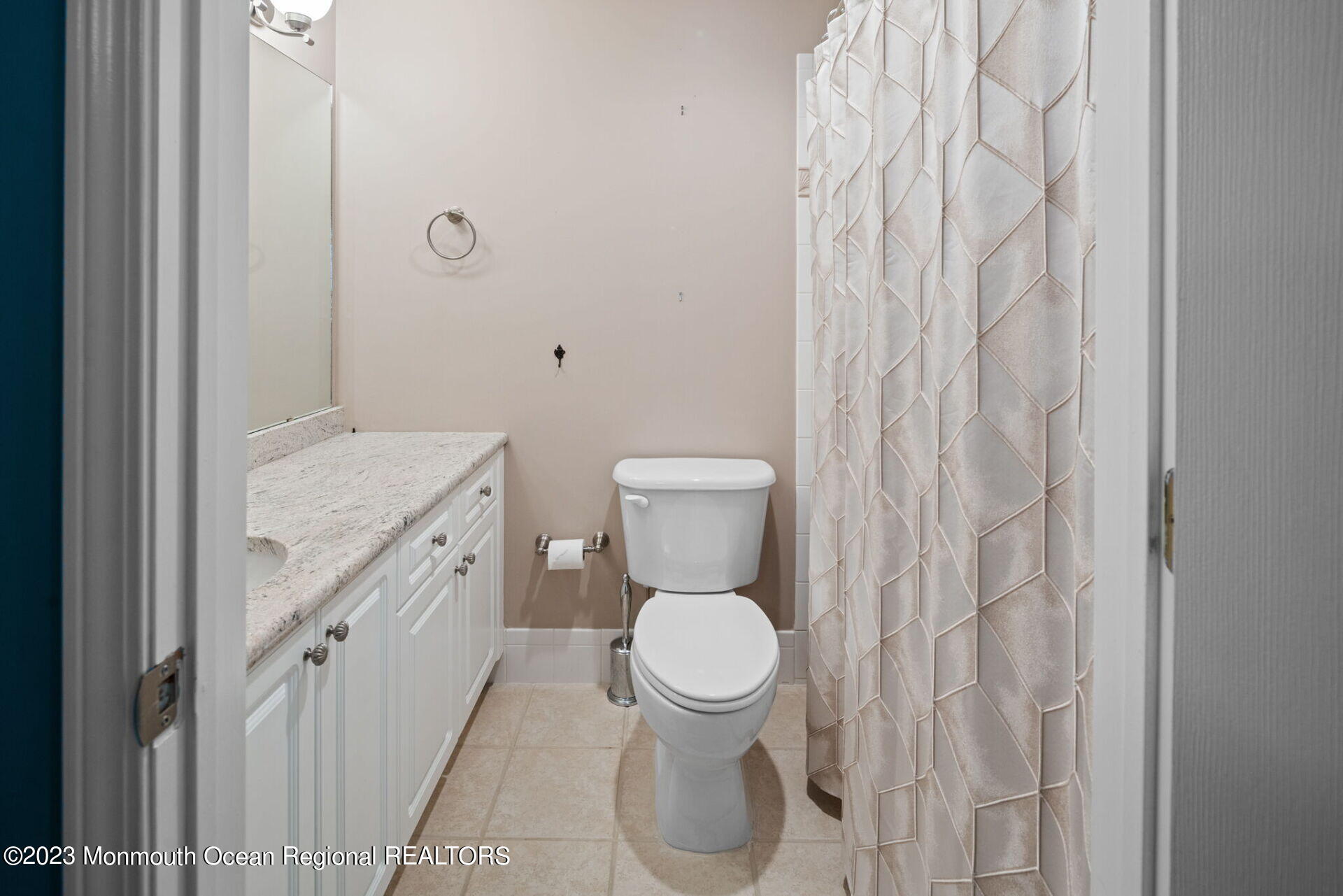 81 Agress Road Millstone Township, NJ 08535 - Photo 29 of 35 a bathroom with a granite countertop toilet and a sink