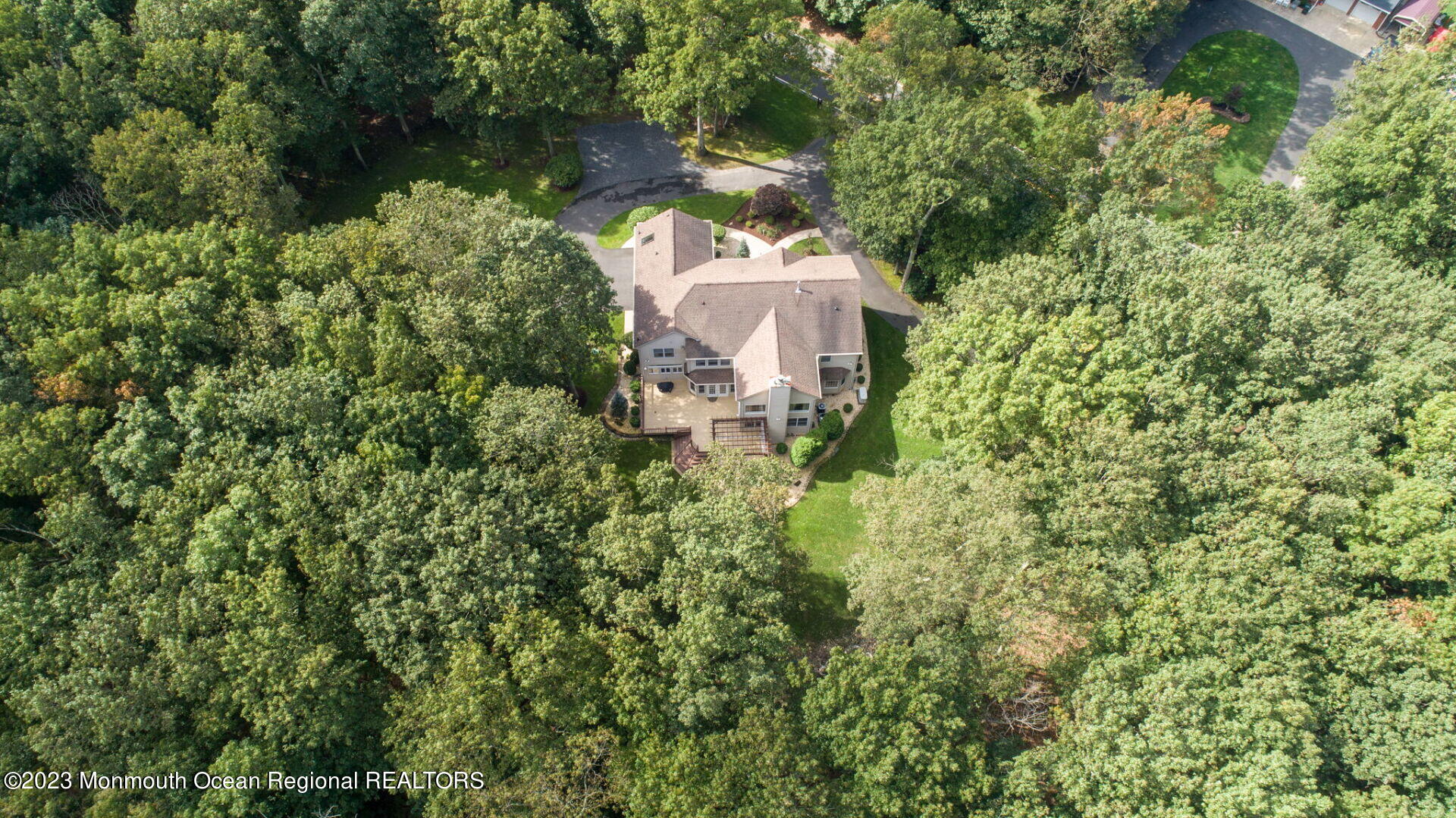 81 Agress Road Millstone Township, NJ 08535 - Photo 35 of 35 an aerial view of a house with a yard